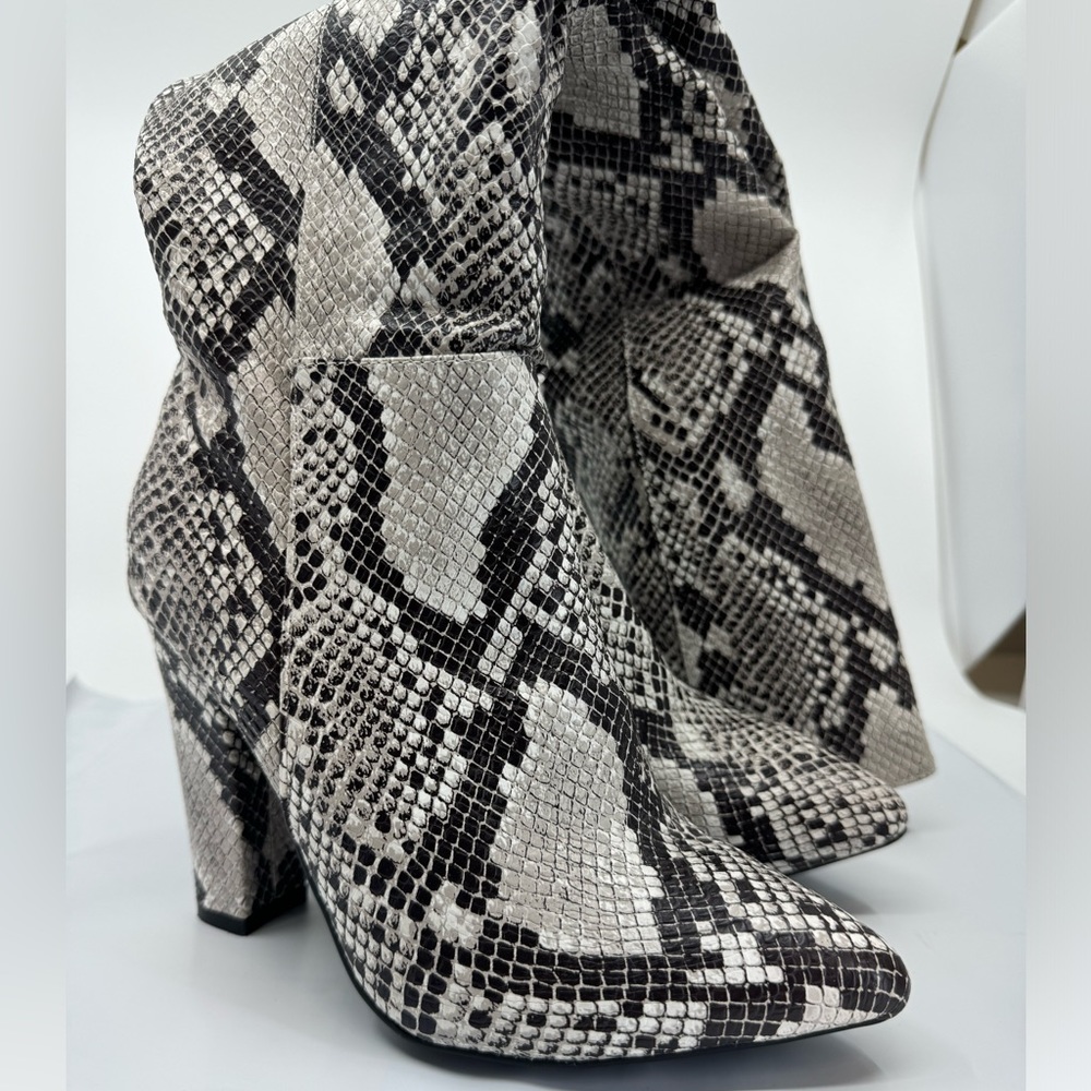 Thigh high snake print boots. Size US women’s 6.5